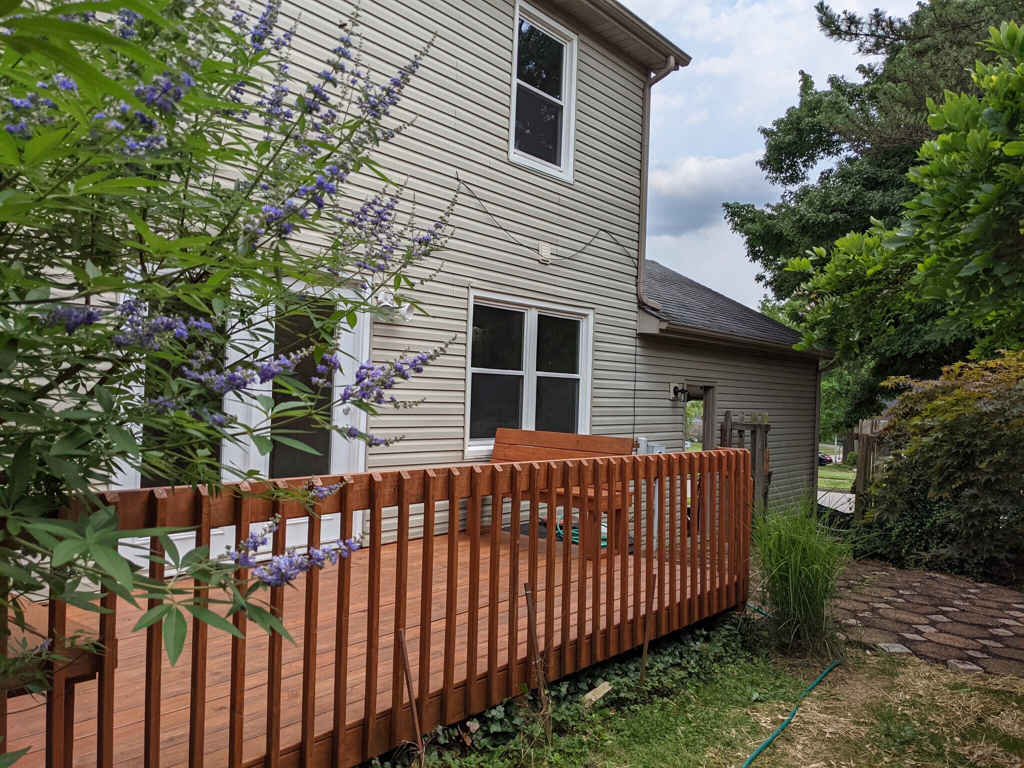 Back deck opens onto paver patio - 3221 Hunters Point Dr