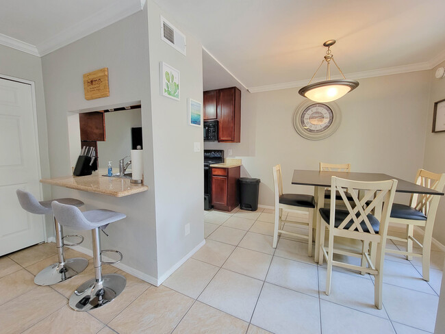 The dining area is connected to the kitchen, yet still offers plenty of space. - 3500 N Hayden Rd