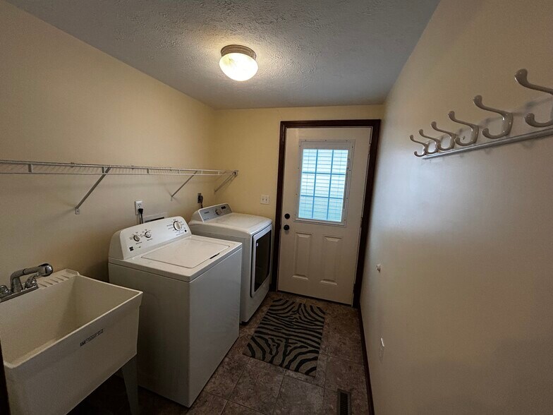 Laundry room with utility sink and back entrance - 14 Conewango Ave