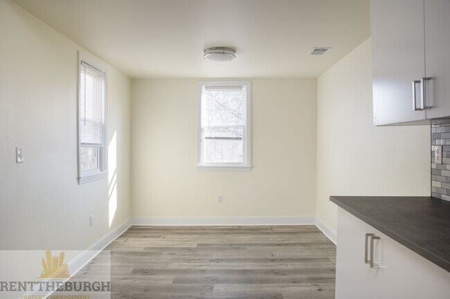 Building Photo - Updated 4BR House with 2 full baths and yard!