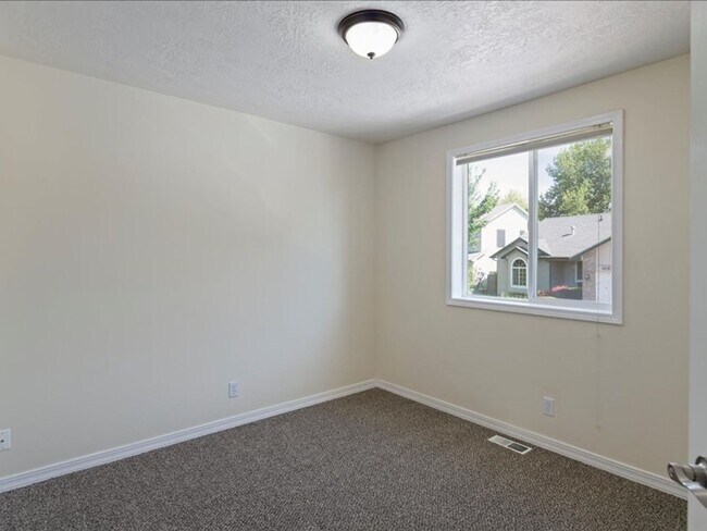 Building Photo - June Rent Free!!  Move Today!  Four Bedroom, Three Bath Home with Beautiful Backyard, Two Car Gar...