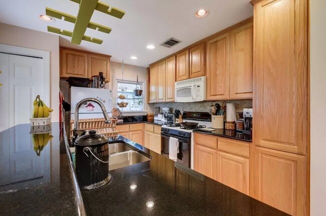 Building Photo - Discover Your Austin Oasis: Revitalized Bungalow with Hardwood Floors and Entertainer's Deck!