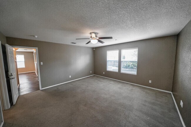 Building Photo - Energy-Smart Single-Story Now Available in...