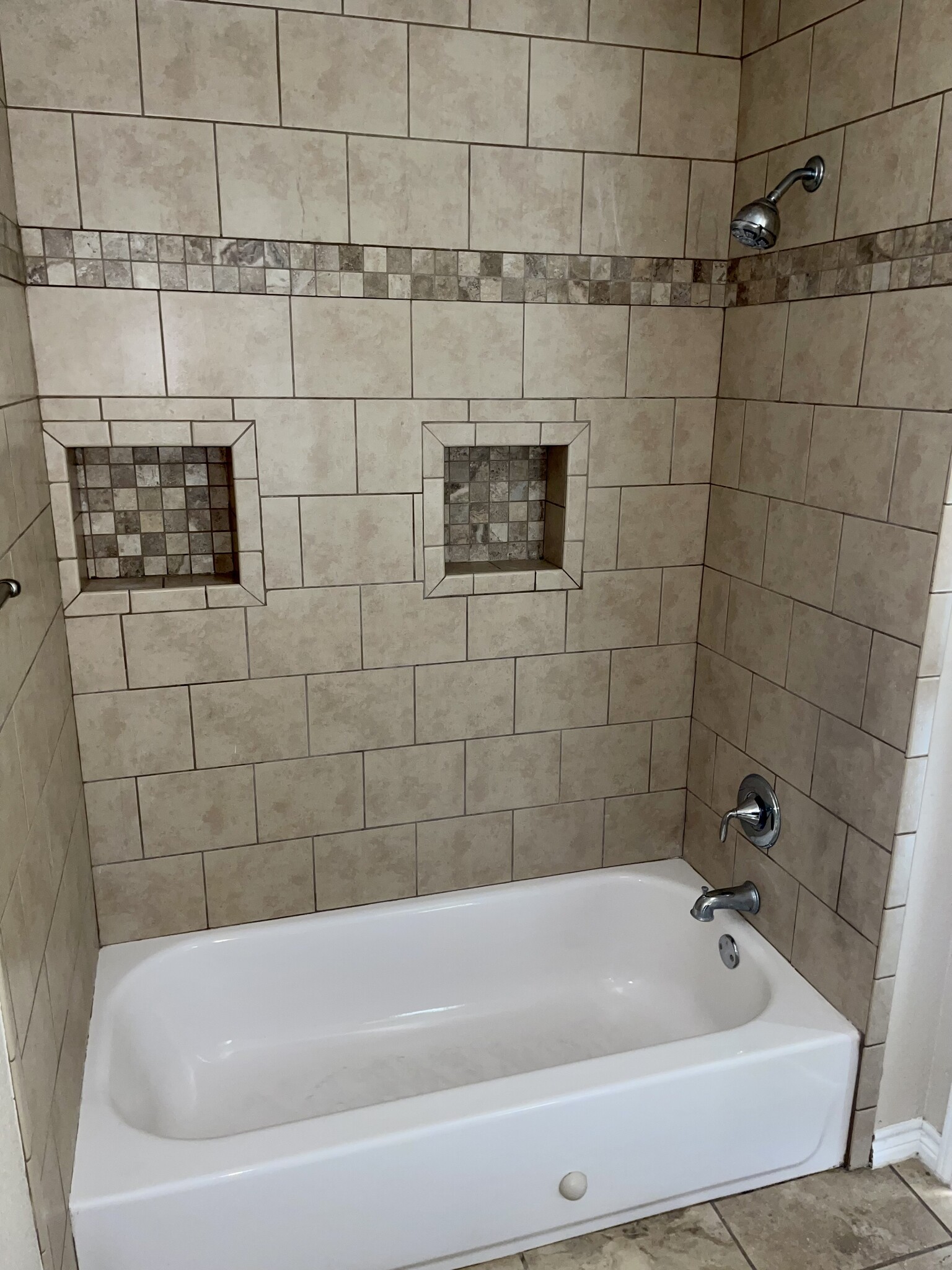 Tiled bathtub in bathroom 2 - 1305 Kings Way