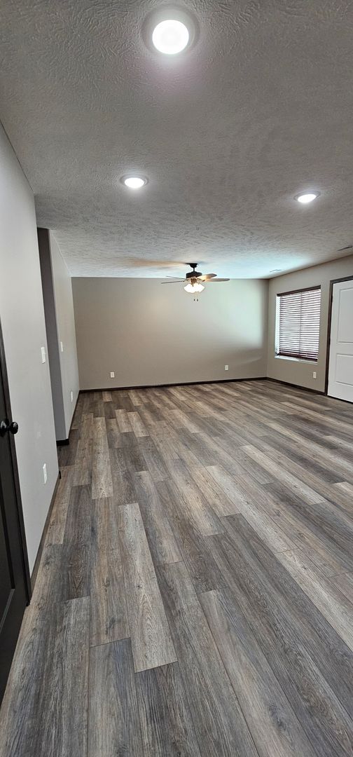 Building Photo - 2-bedroom, 1 bathroom apartment with 2 car attached garage