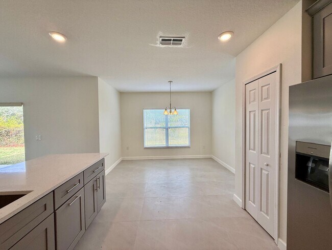 Building Photo - GORGEOUS, Large Completely Renovated Two-Story 4/2.5 PLUS LOFT in POINCIANA VILLAGES!
