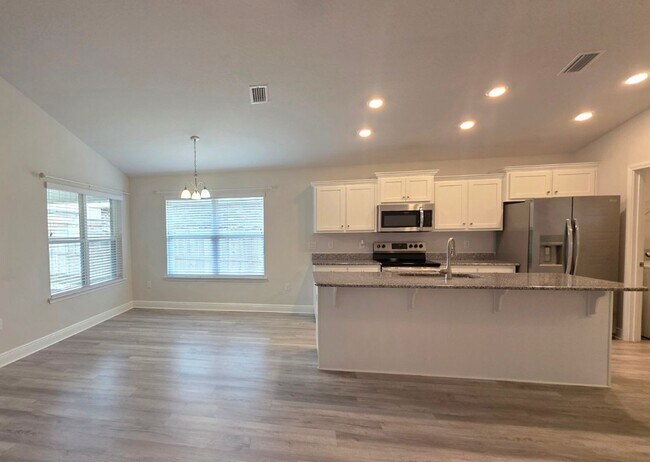Building Photo - Bright, Open Layout | Screened Porch + Paver Patio | Move-In Ready
