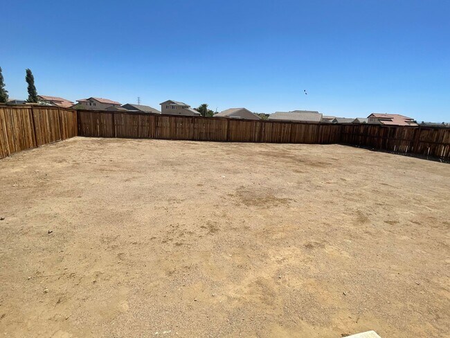 Building Photo - Adelanto Home-3 Bedrooms,2 Bathrooms, Laminate Floors, Indoor Laundry Room, Large Back Yard