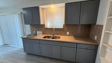 Building Photo - 10838 Vernon Ave