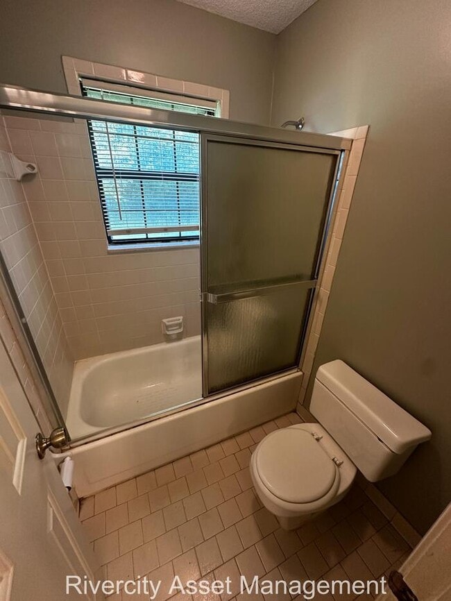 Building Photo - charming three-bedroom, two-full-bath resi...