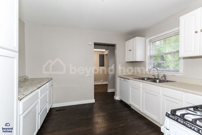 Building Photo - Updated Bungalow with Massive Deck and Fully Fenced Yard!