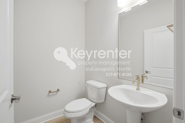 Building Photo - Located in Westfield, IN, this attractive 3-bedroom, 2.5-bath home sits on a corner lot within an...