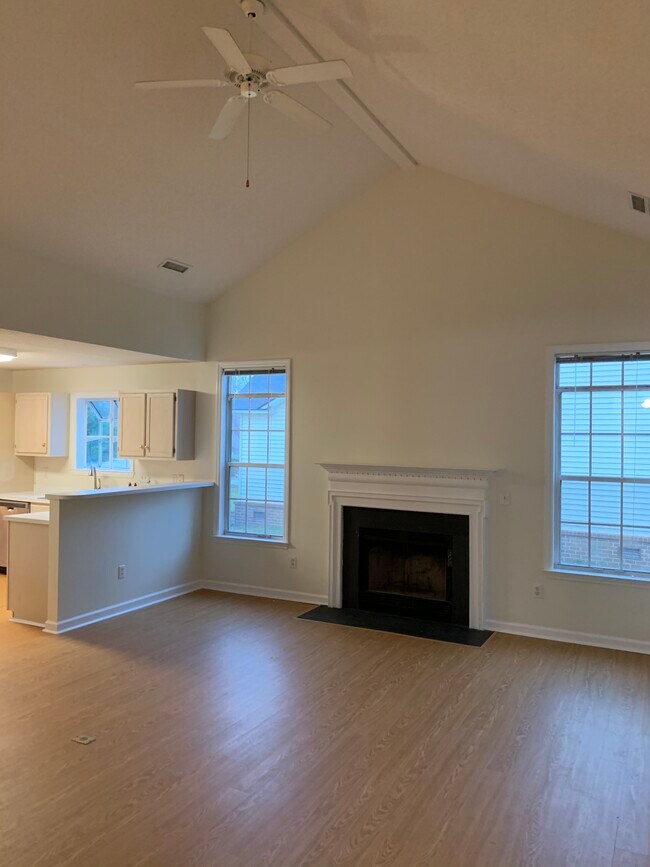Living room with fire place and kitchen - 1079 Wayfarer Ln