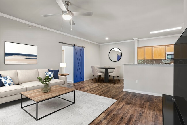 Kitchen, living, and dining area with hard surface flooring - eaves Twin Creeks