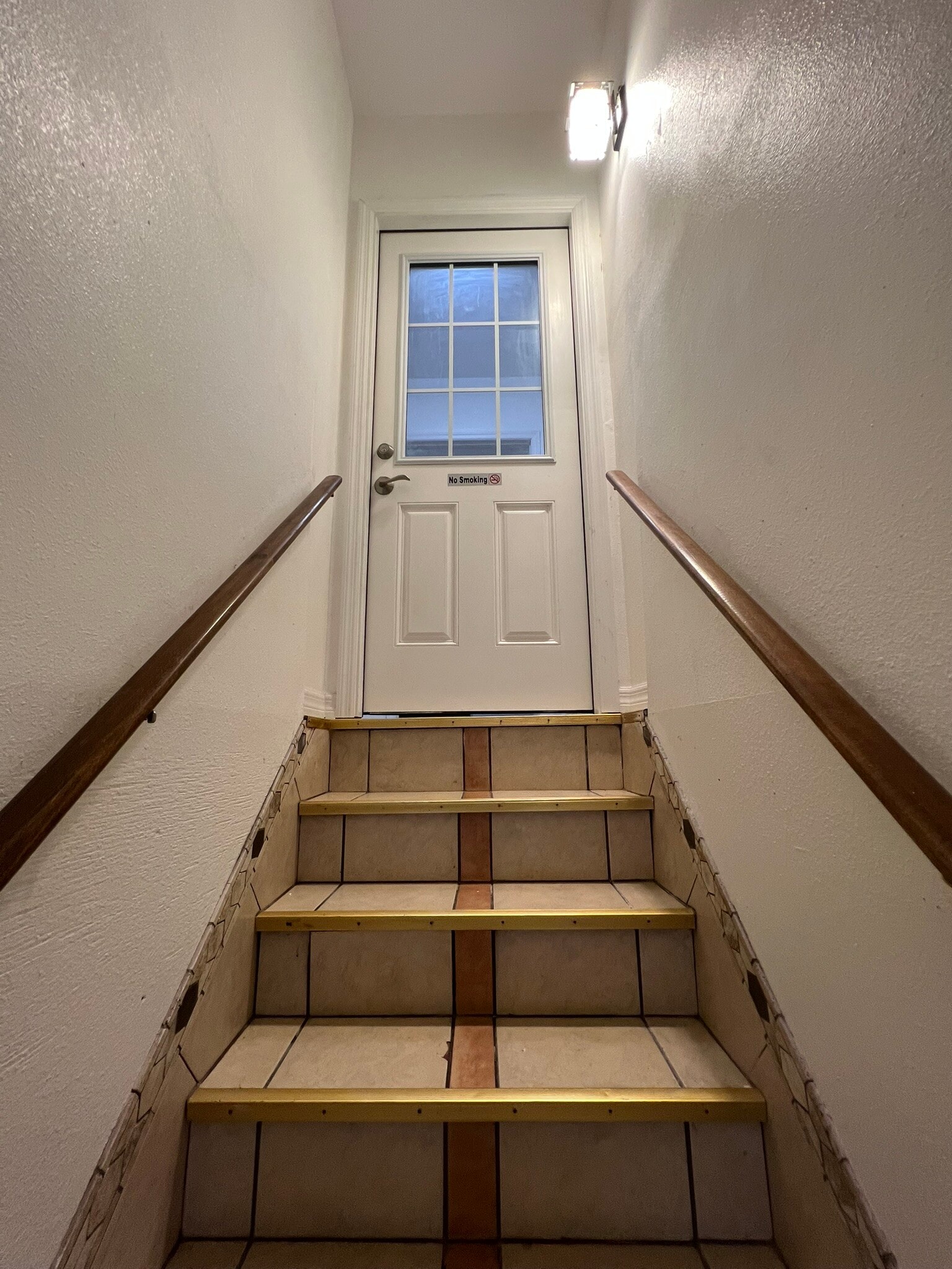Stairwell and apartment door - 2540 Greenwood Dr