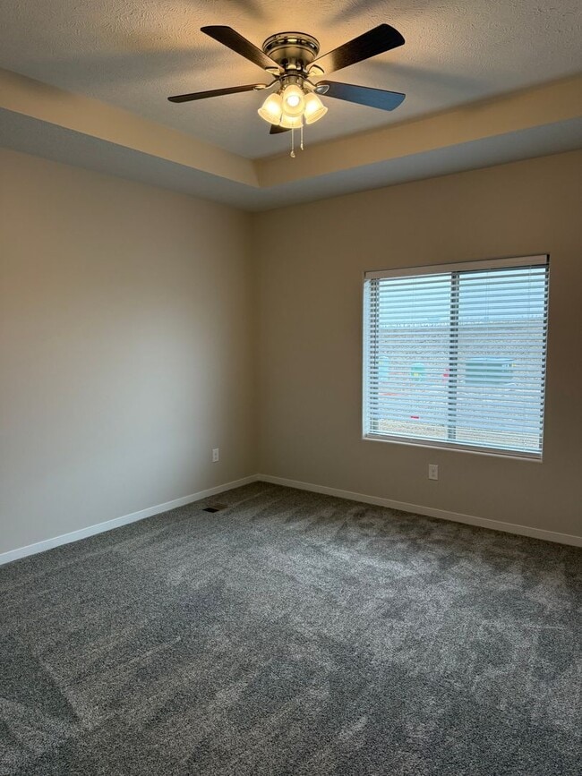 Building Photo - Walkout ranch townhome with 2 stall garage...