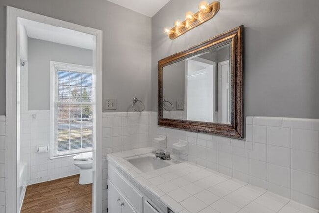 Building Photo - Large Brick Ranch, New Wood Like Flooring Throughout, Just Painted, LR, Den, Sun Room, Carport!