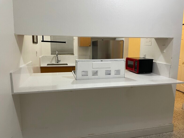 Kitchen view from living room - 665 NE 83rd Ter
