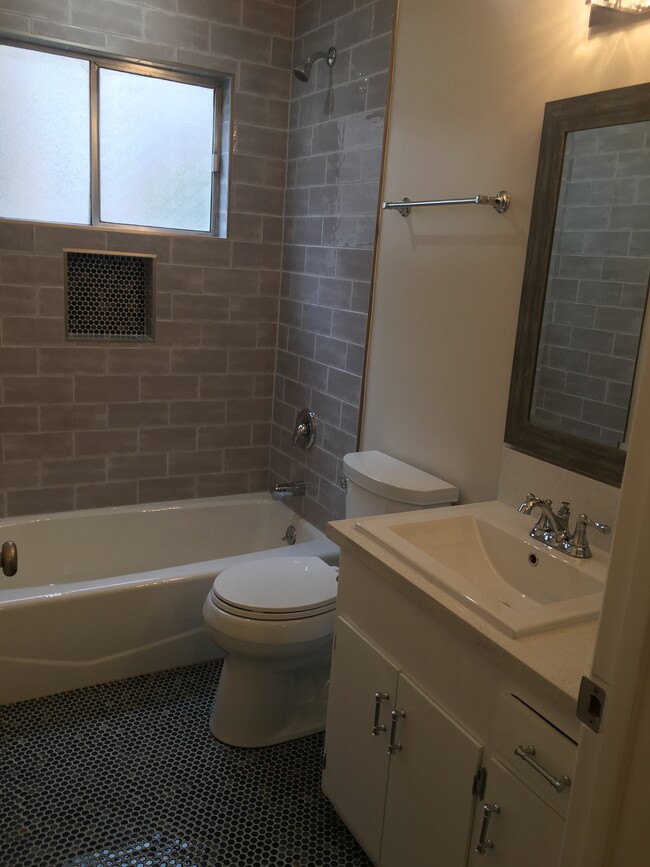 Custom tiled bathroom with designer finishes - 1016 Western Ave