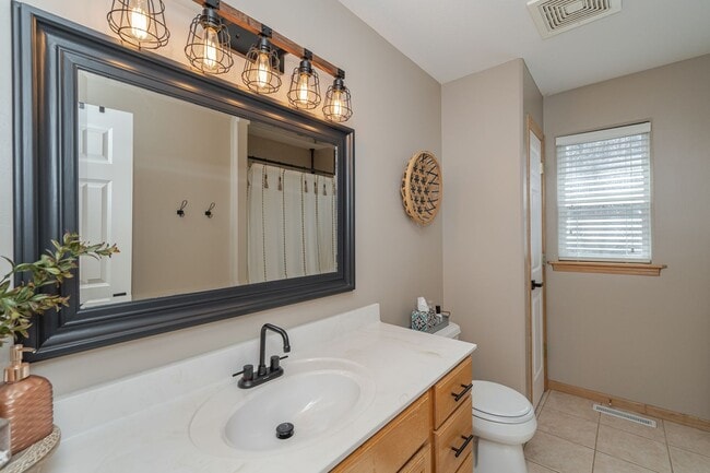Building Photo - Spacious Home With Finished Basement And 3 Car Garage