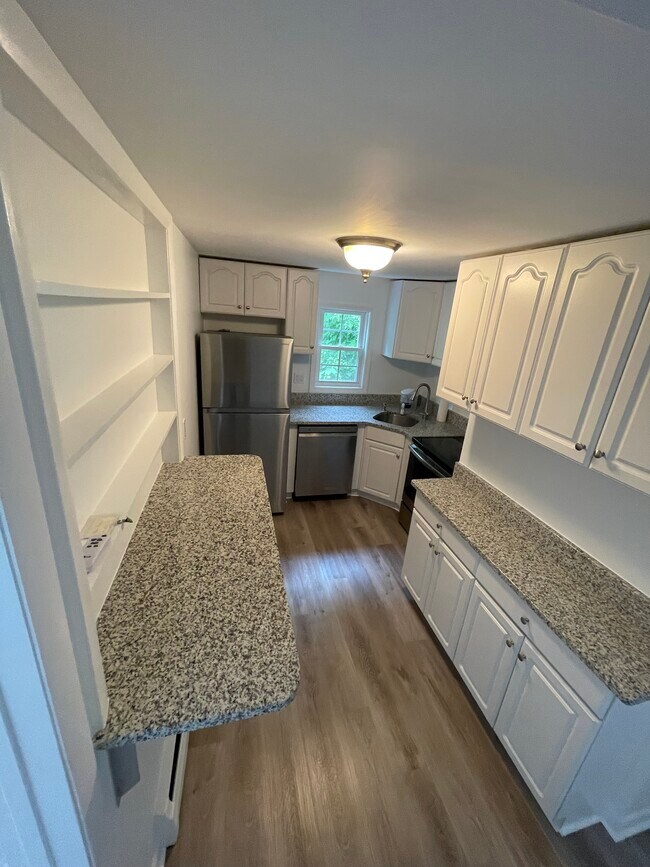 Galley kitchen with all new stainless appliances - 100 Washington Park Dr