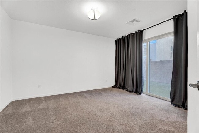 Building Photo - Stunning 4-Bedroom Home in Gated Community Near I-215 & Top Amenities!