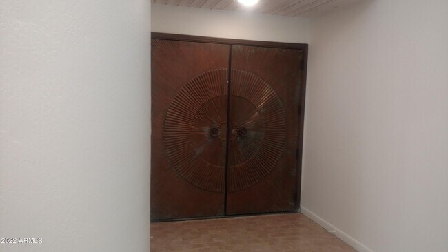 6. Grand Copper Doors - 33 W Missouri Ave