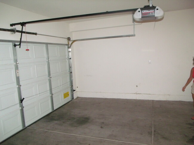 Building Photo - Townhome with Two Car Attached Garage/Gate...