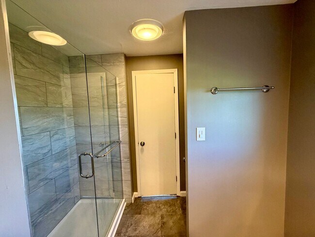 Building Photo - Modern Comforts Await: Spacious Rental with 2-Car Garage, Private Office, and Finished Basement w...