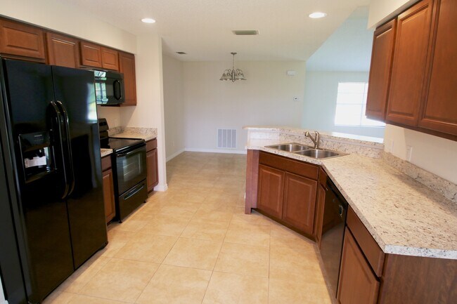 Building Photo - Spacious 3BR/2BA Home | Large Yard | Lawn Care Included | Prime Port St. Lucie Location