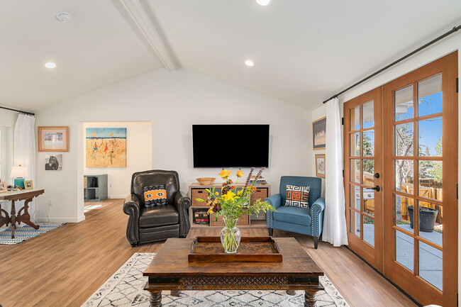 Front door and wall of windows to the left (out of frame) let in an abundance of natural light - 881 3rd St