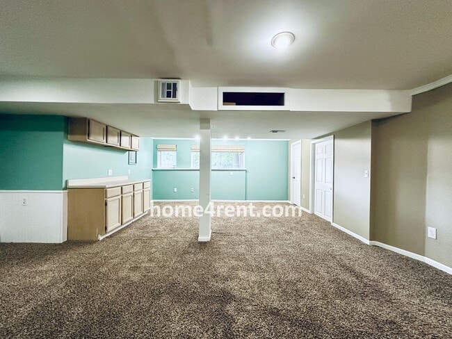 Building Photo - Blue Valley Schools w/ Wood Floors, Finished Basement and a Peaceful, Private Fenced Yard!