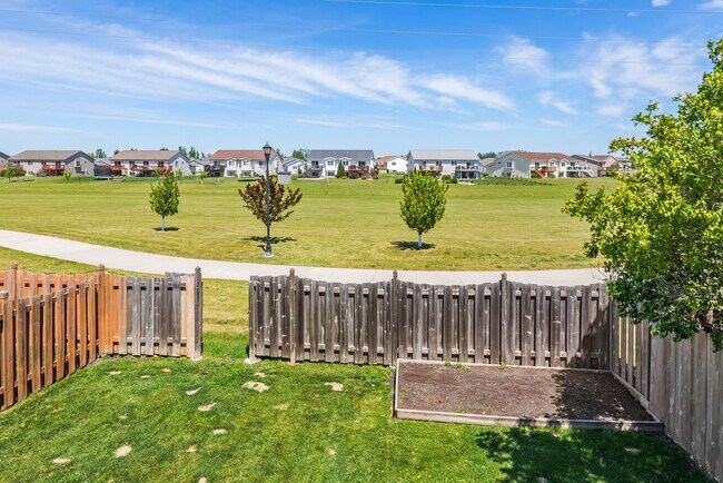 Fenced in yard with no backyard neighbors. This green space is amazing! - 998 38 1/2 Ave W