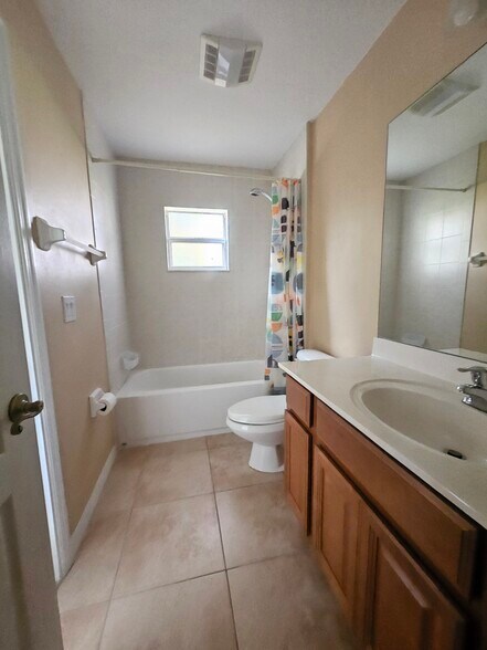 Nice sized 2nd bathroom with tub. Great storage space in cabinets and additional storage closet near - 3615 Soft Breeze Cir