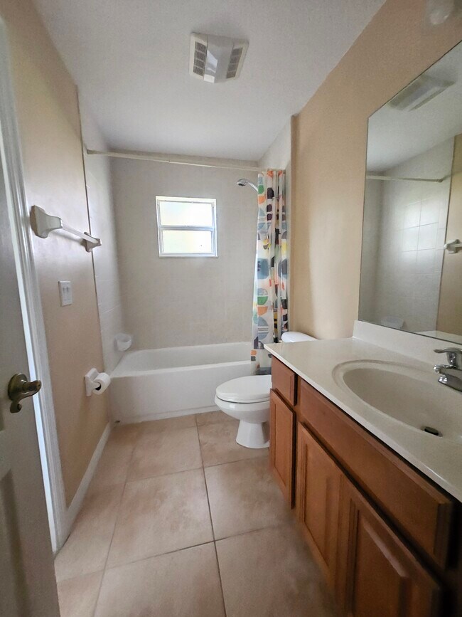 Nice sized 2nd bathroom with tub. Great storage space in cabinets and additional storage closet near - 3615 Soft Breeze Cir