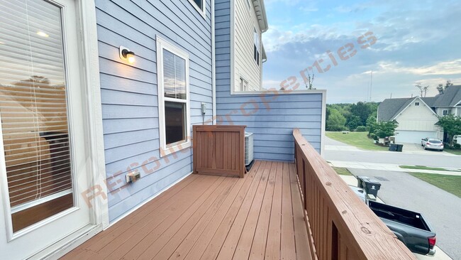 Building Photo - 3 Story Townhome 3 Bedrooms Rear Entry 2 Car Attached Garage with 1st Floor Bedroom, Community Po...