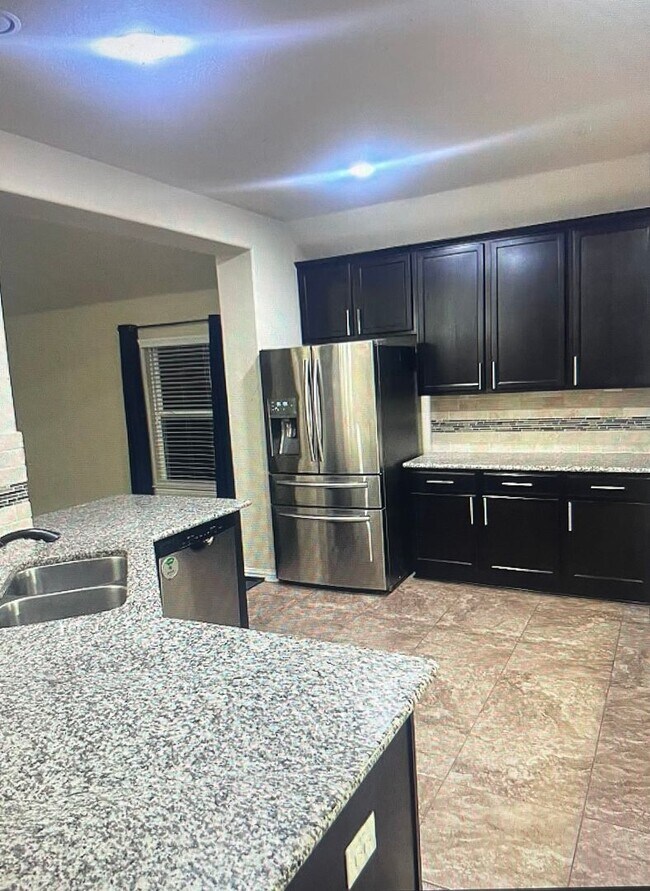 Building Photo - One-and-a-half story, 4 bedroom home - Available early June!