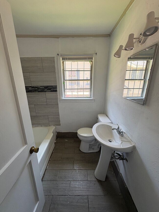 Building Photo - Large 3 bedroom, 2 bath with refrigerator!