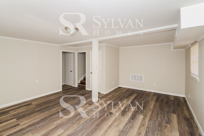 Building Photo - Welcome to this charming abode.