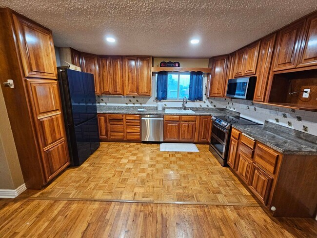 Building Photo - 4-Bedroom Home with In-Ground Pool, Solar ...
