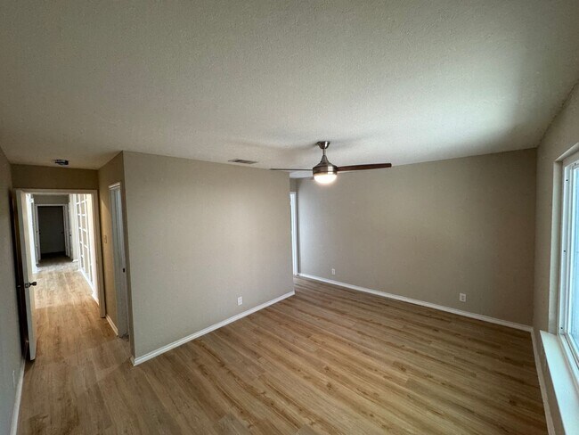 Building Photo - NEW PAINT, FLOORING, APPLIANCES & ROOF  | ...