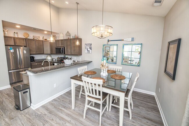 Building Photo - This spacious 3-bedroom, 2-bathroom townhouse offers modern living