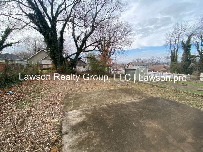 Building Photo - Updated Three Bedroom with Flat Yard