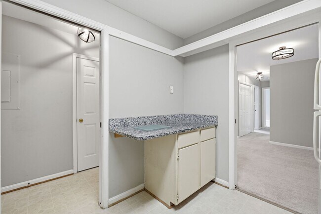 Building Photo - Contemporary design meets exceptional space in this inviting ground level residence, offering eff...
