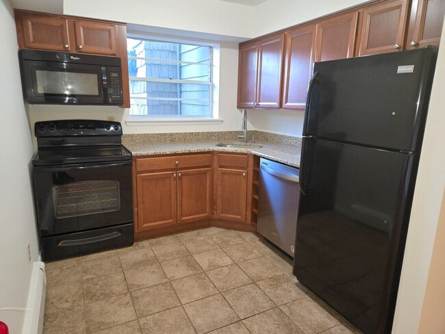 Building Photo - Updated, spacious 1st fl 1-bedroom/1-bathroom condominium with most utilities included & lots of ...