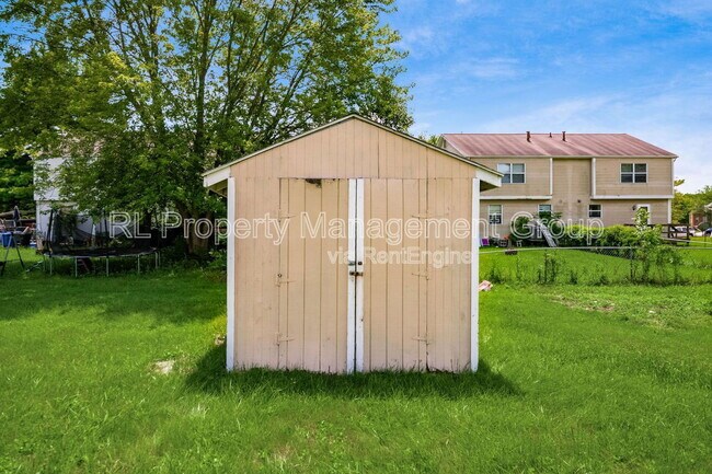 Building Photo - 7179 Feather Ct