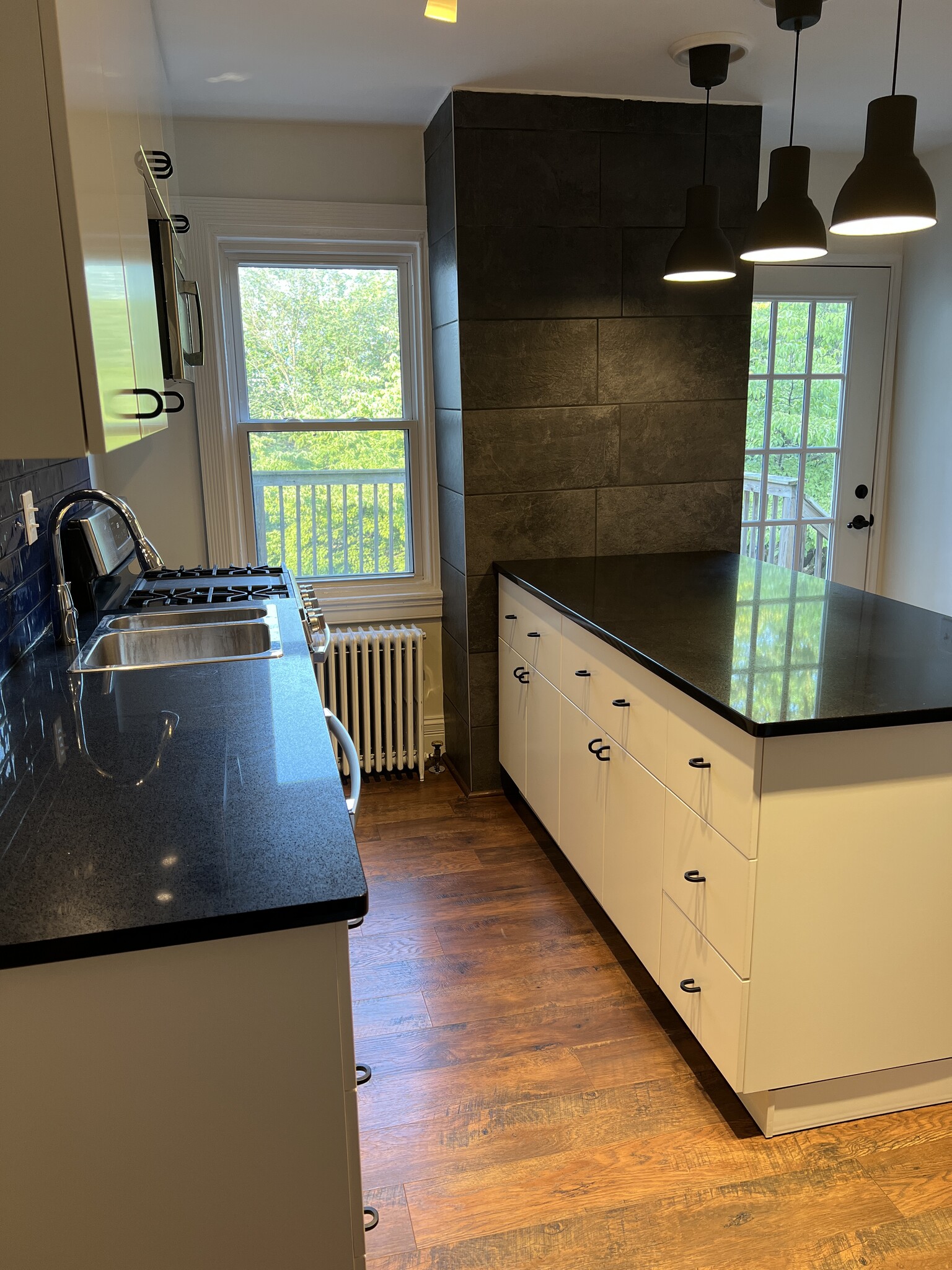 Galley style kitchen featuring quartz count with plenty of counter space for those who love to cook. - 126 Merion Ave