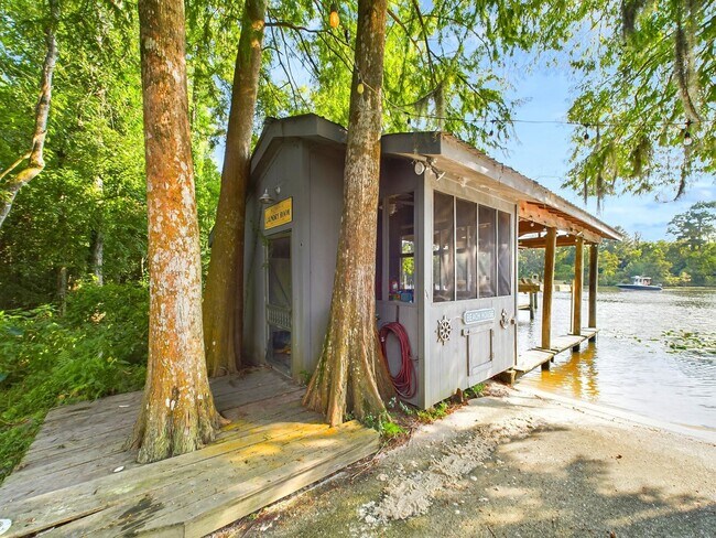 Building Photo - Private Furnished Riverfront Estate with Dock & Guest Apartment