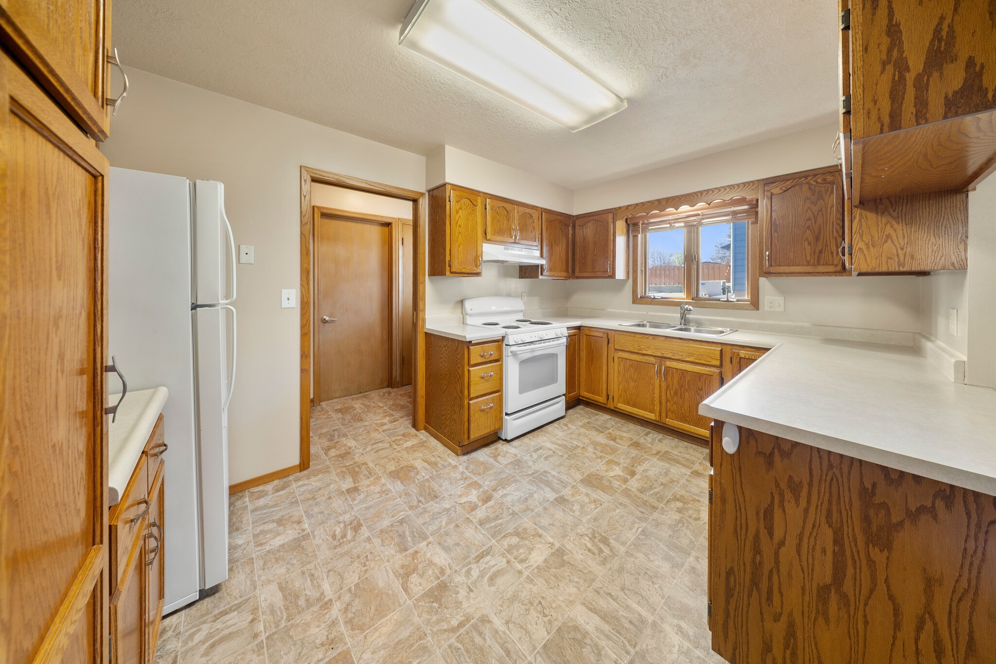 Kitchen to hallway and back door - 2405 W 28th St