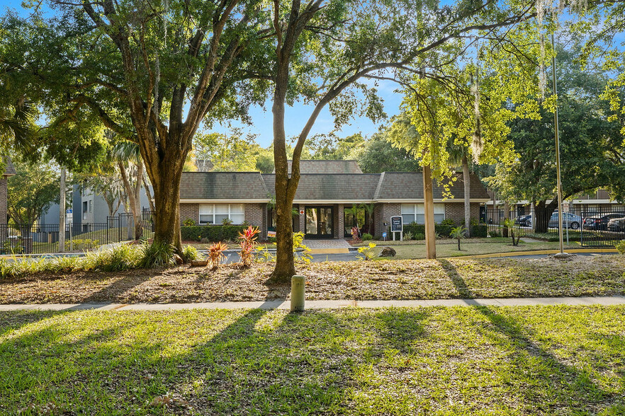 Step into serenity at this charming apartment community, nestled within vibrant greenery. - Doral Oaks